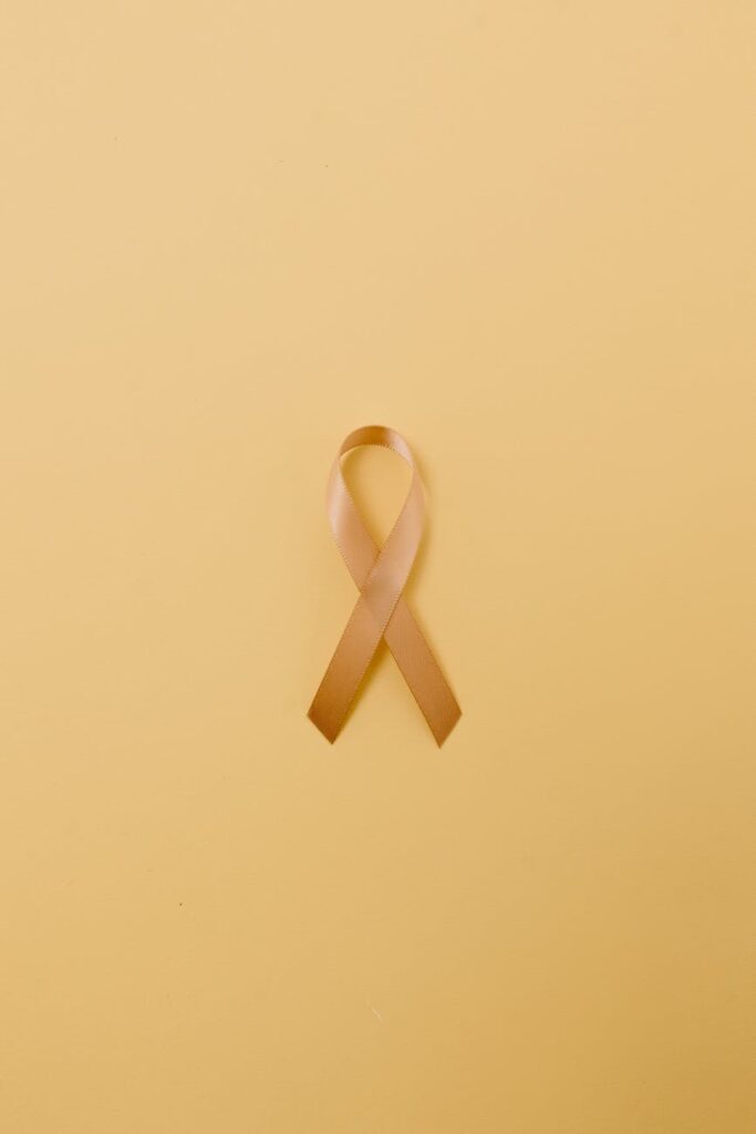 a gold childhood cancer awareness ribbon